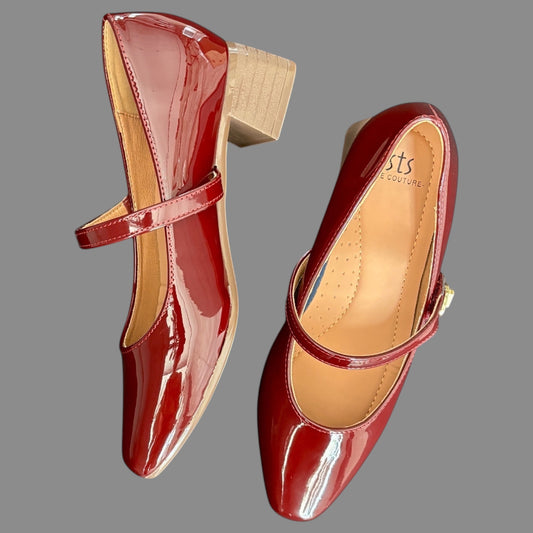 WALK WITH ASHOKA deep red glossy patent Mary Jane pumps with a block heel and instep strap on a grey background.