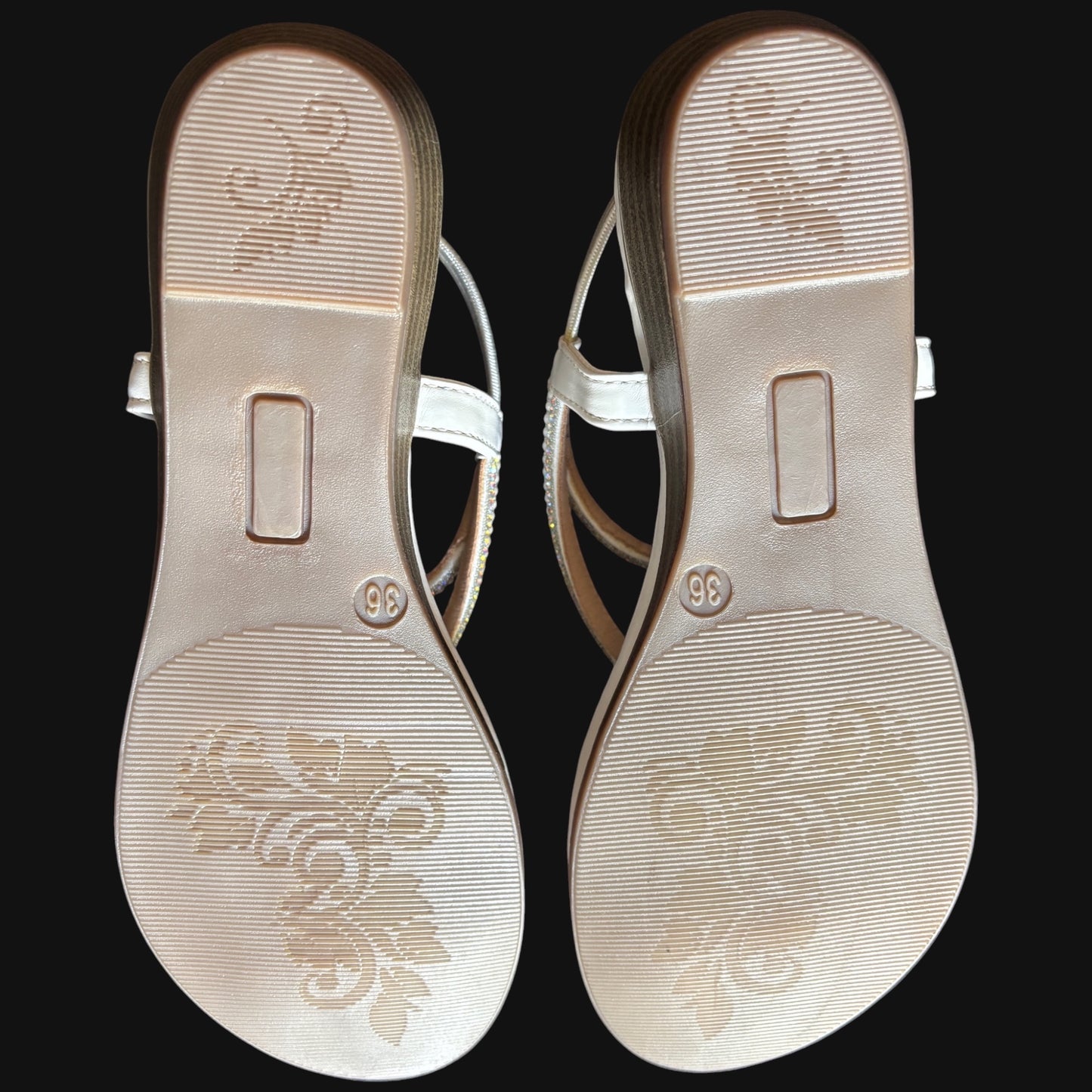 WALK WITH ASHOKA white embellished flat sandals showing the textured patterned outsoles with floral detailing