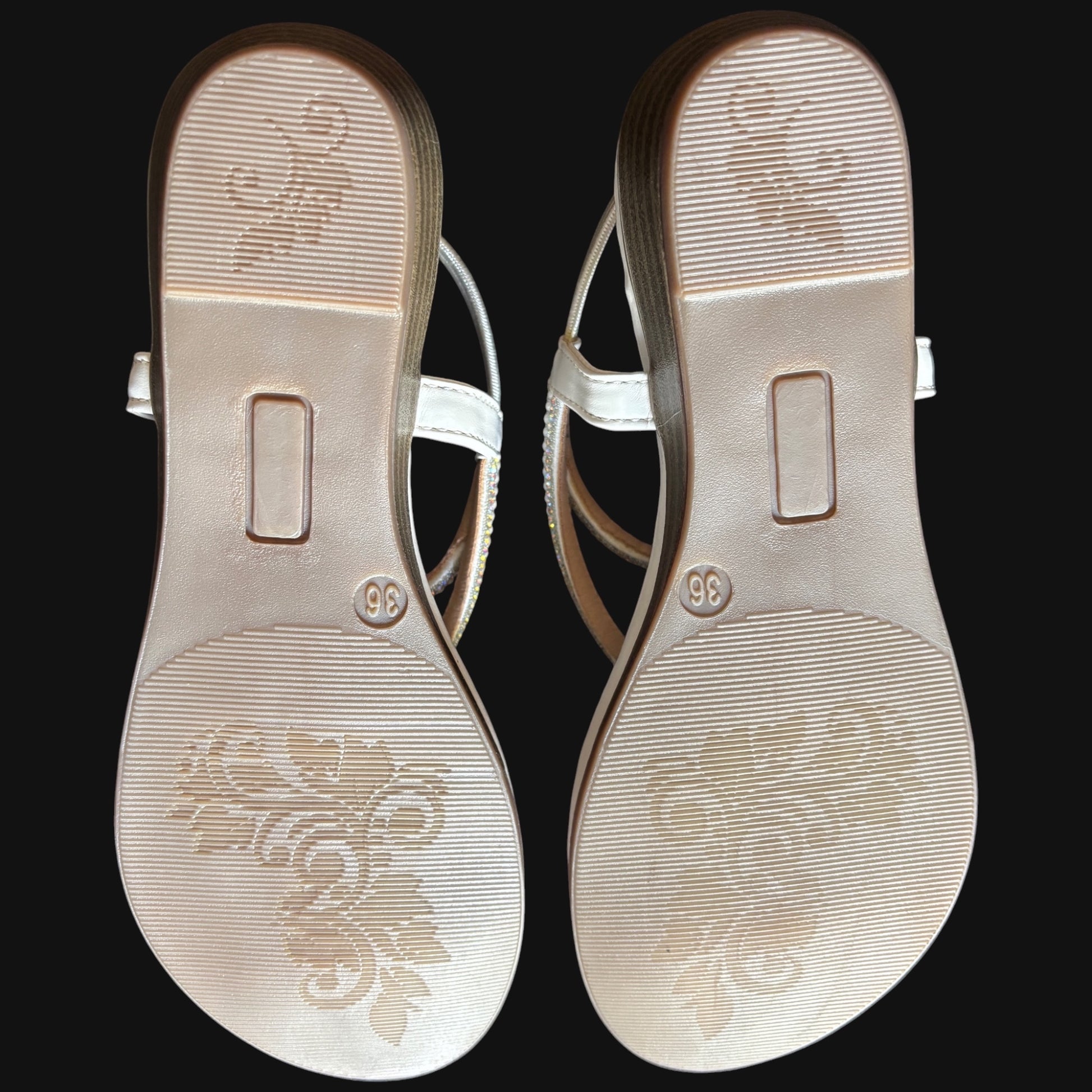 WALK WITH ASHOKA white embellished flat sandals showing the textured patterned outsoles with floral detailing