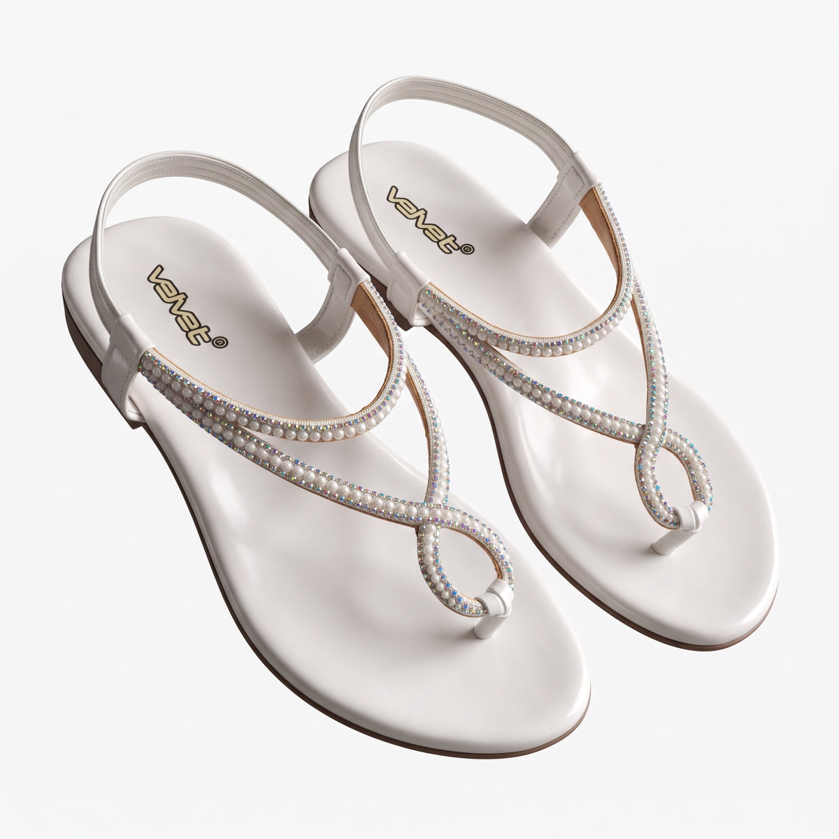WALK WITH ASHOKA white flat thong sandals featuring crystal and faux pearl embellishments with a secure ankle strap.