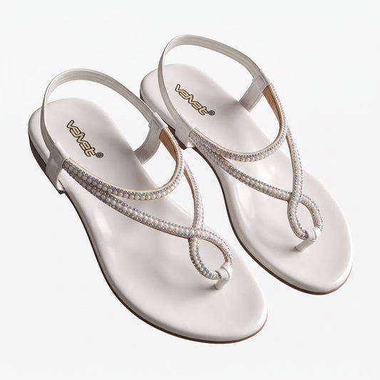 WALK WITH ASHOKA white flat thong sandals featuring crystal and faux pearl embellishments with a secure ankle strap.